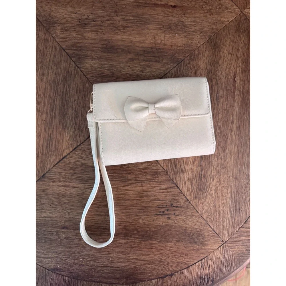 Madden Girl Cream Faux Leather Bow Wristlet Wallet Cream Gold Tone Logo